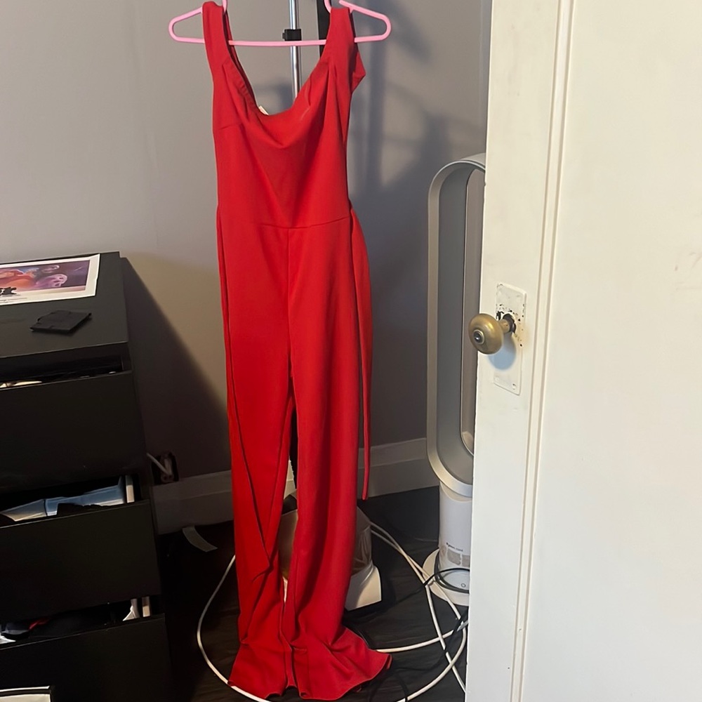 Red one piece jump suit with tie waist